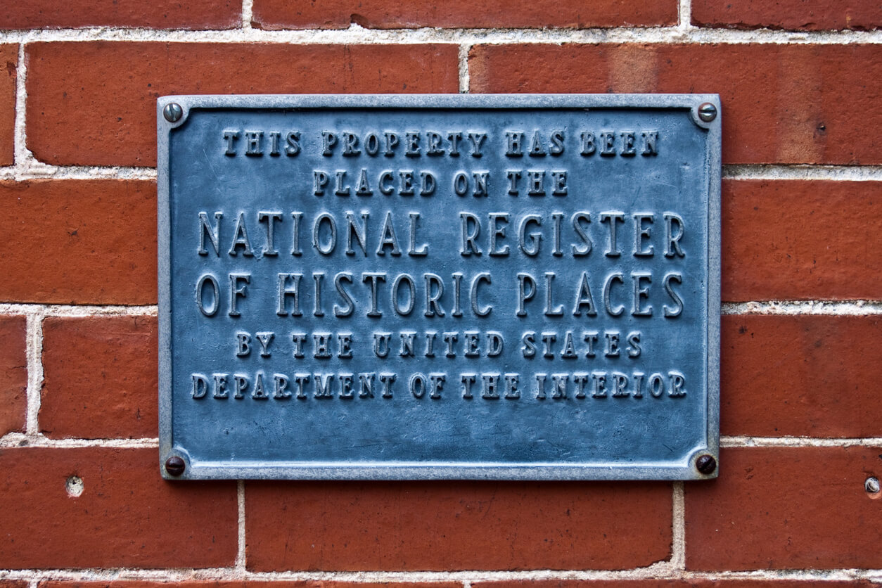 NHRP plaque on building - national register of historic places nomination form services